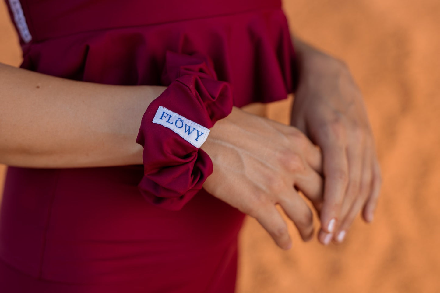 Burgundy Giselle Scrunchie worn on the hand as accessory