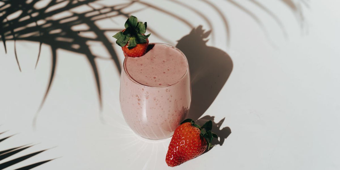 easy-to-make strawberry-banana smoothie in the shade of a plant