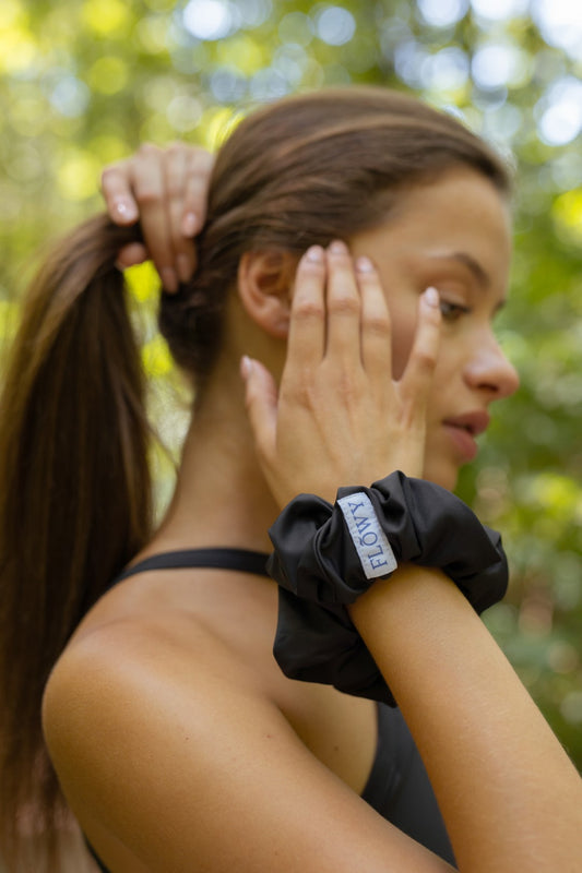 Gray Giselle Scrunchie on the hand