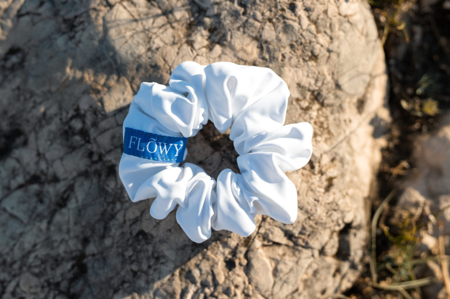 White Giselle Scrunchie laid out flat